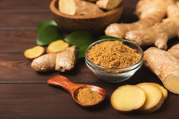 Fresh ginger on wooden background. Dry ginger. Sliced ​​ginger with honey and lemon. Ginger...