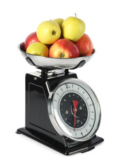 Retro mechanical kitchen scale with apples isolated on white