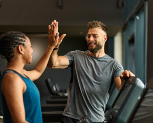 gym sport fitness exercise health training woman teamwork happy together friend success high five trainer instructor gesture support coach motivation treadmill running man trainer instructor coach