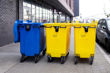 Yellow and blue Recycling Bin for plastic Waste. Waste containers for garbage segregation in...