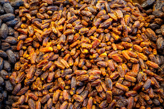 Close-up of dried dates on display at a market. Naturally sweet and rich in fiber, dates are a popular healthy snack and a staple in Middle Eastern and North African cuisine.