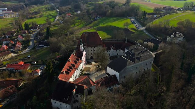 Aerial view of Tittmoning Castle, historic medieval fortress located in Traunstein district of Bavaria, Germany. Scenic landscapes, stone walls, cultural heritage site. Luftaufnahme Burg Tittmoning. 