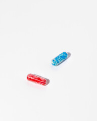 Medical pill capsules filled with colorful sugar sprinkles, creative concept