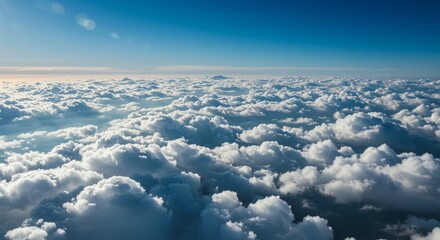 Naklejka premium Stunning Aerial View of a Sea of Fluffy Cumulus Clouds under a Bright Blue Sky