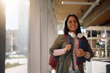 Happy Indian student at university looking at camera.