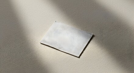 Blank Clothing Label Mockup on Fabric with Light and Shadow