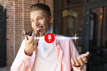 Young man recording voice message via smartphone outdoors. Illustration of microphone and sound...