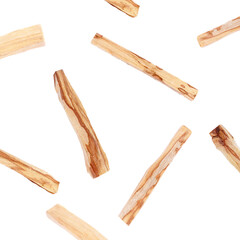 Palo santo sticks falling on white background