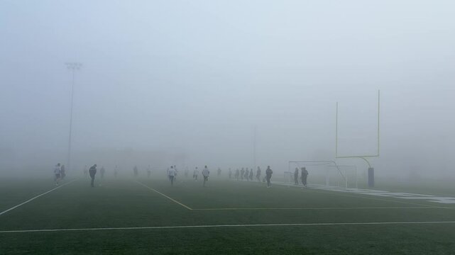 Air Force members working out in a morning fog