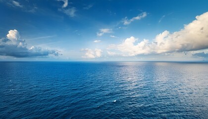 Fototapeta premium meeting of sea and horizon accompanied by a vast sky above displays captivating beauty of open water and evokes a feeling of liberation