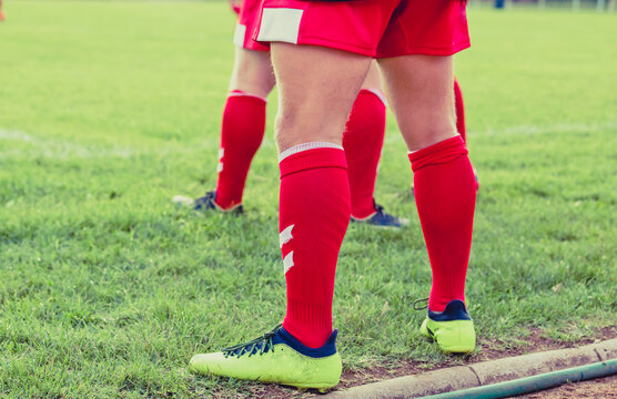 Male rugby players. Football boots