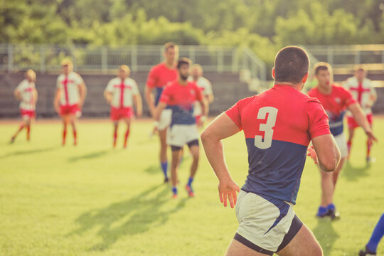 Rugby game with out of focus players in the background