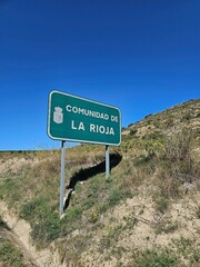Scenic vineyards in La Rioja, Spain, under a golden sunset—rolling hills, wine country charm, and rustic Spanish countryside beauty
