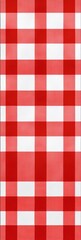 A close-up shot of a traditional red and white checkered tablecloth, often used for outdoor or rustic themed events