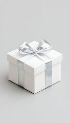 Fototapeta premium Elegant white gift box with silver ribbon (1)