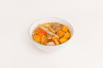 Bun Rieu Cua, Crab paste vermicelli soup with minced shrimp, tofu, tomato, shrimp paste, Vietnamese food isolated on white background, close up