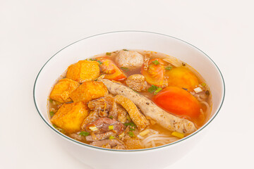 Bun Rieu Cua, Crab paste vermicelli soup with minced shrimp, tofu, tomato, shrimp paste, Vietnamese food isolated on white background, close up