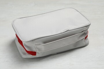 First aid kit on white table, closeup