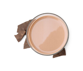 Tasty chocolate milk in glass and pieces of chocolate isolated on white, top view