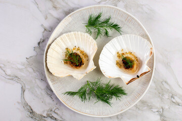Grilled scallops with butter, quinoa pop, garlic, lime