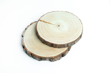 Simple and natural, two overlapping slices of rustic timber clearly showing detailed tree rings, providing a versatile and eco-friendly background for crafts, products, or environmental themes.