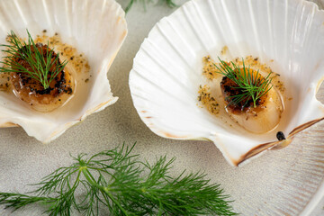 Grilled scallops with butter, quinoa pop, garlic, lime