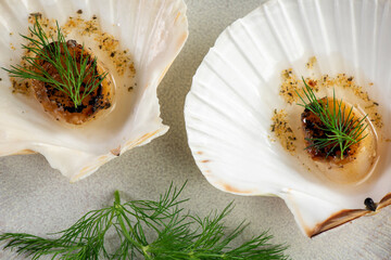 Grilled scallops with butter, quinoa pop, garlic, lime