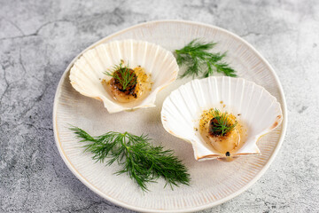 Grilled scallops with butter, quinoa pop, garlic, lime