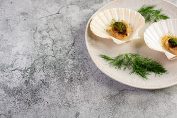 Grilled scallops with butter, quinoa pop, garlic, lime