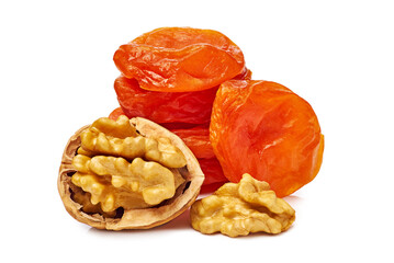 A Beautiful Arrangement of Dried Apricots and Walnuts Stacked Together on a White Background