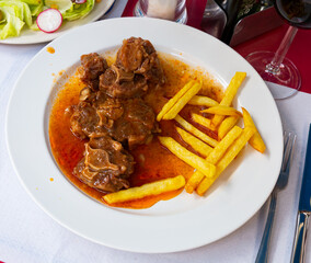 Oxtail in sauce - Rabo de toro. Spanish dish. High quality photo