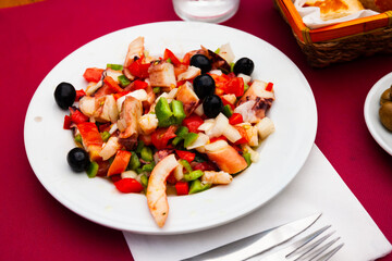 Salad Salpicon de marisco with olives, shrimps, octopus, mussels and cucumbers
