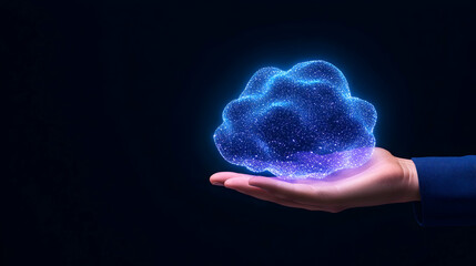 Glowing digital cloud held in a hand against a dark background
