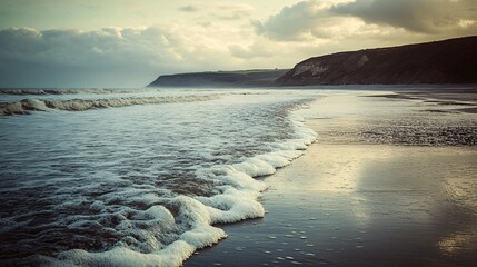 Fototapeta premium A tranquil coastal scene depicting summer waves merging into cooler autumn sea