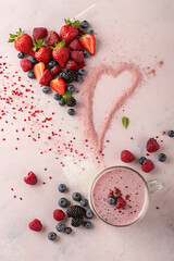Berry protein shake with heart shaped protein powder.