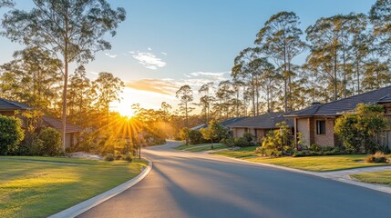 Sunset view of a residential street lined with houses and trees