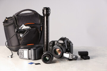 Professional photographer's equipment and case on light table. Space for text