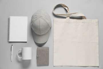 Different blank items for branding on gray background, flat lay. Mockup for design