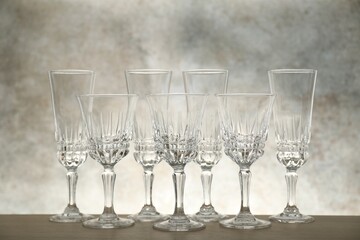 Many empty clean glasses on wooden table