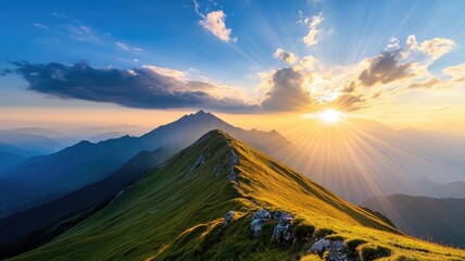 Majestic mountain landscape at sunrise with sun rays and scenic ridge