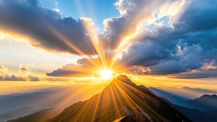 Stunning sunrise over mountain peak with dramatic clouds and sun rays