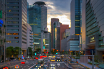 Osaka, Japan - Sep 25 2024, panoramic view of a wide street with cars and buses, trees are planted...