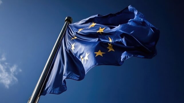 European Union flag waving in the wind against a clear sky