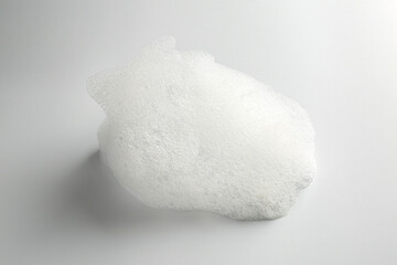 Detergent foam with bubbles on white background, closeup