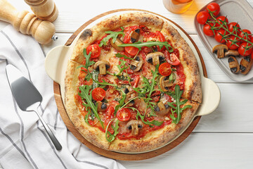 Tasty pizza with mushrooms, tomatoes, arugula and server on white wooden table, flat lay