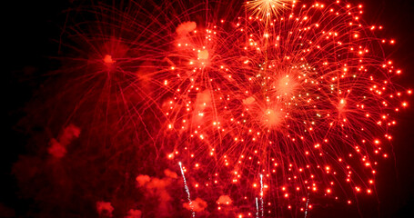 Fototapeta premium Red Firework celebrate anniversary happy new year 2025, 4th of july holiday festival. red firework in night time celebrate national holiday. Countdown to new year 2025 festival party time event
