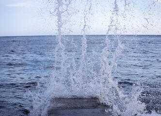 Stormy waves crashing against rocks on the Atlantic coast of Portugal on the island of Madeira