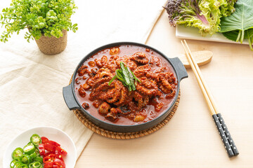 Traditional Korean Spicy Stir-Fried Octopus (Nakji Bokkeum) in a Hot Pan