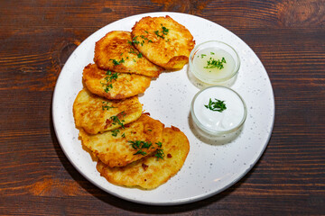 Delicious potato pancakes served with creamy dips