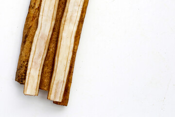 Burdock Root (Gobo) on white background.